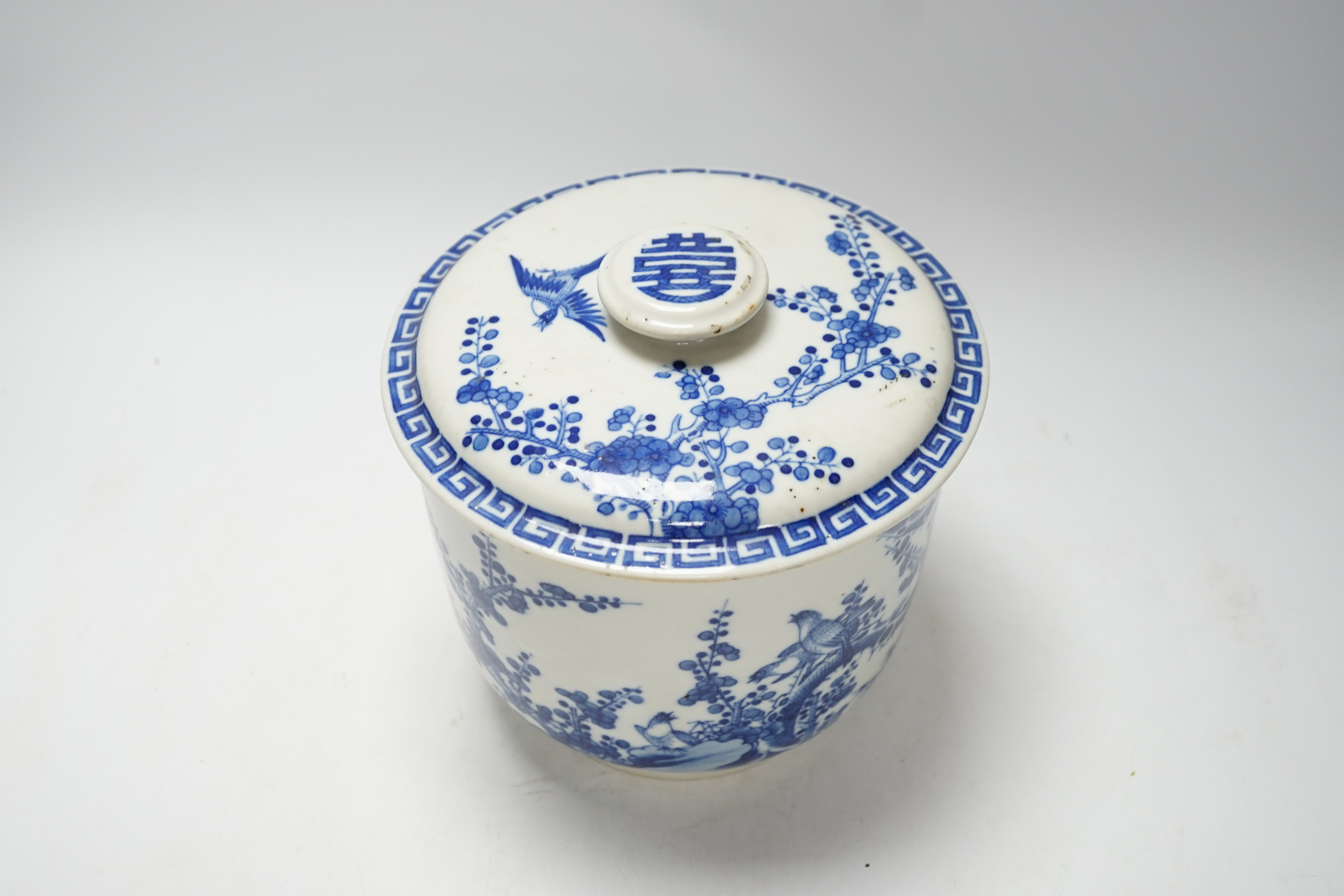 A Chinese porcelain blue and white inscribed jar and cover, 19th century, possibly made for the Vietnamese market, 18cm high